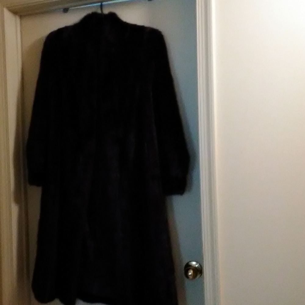 Full length black genuine mink coat. Side slits.